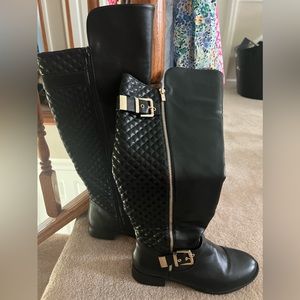 Black knee high boots. Barely worn